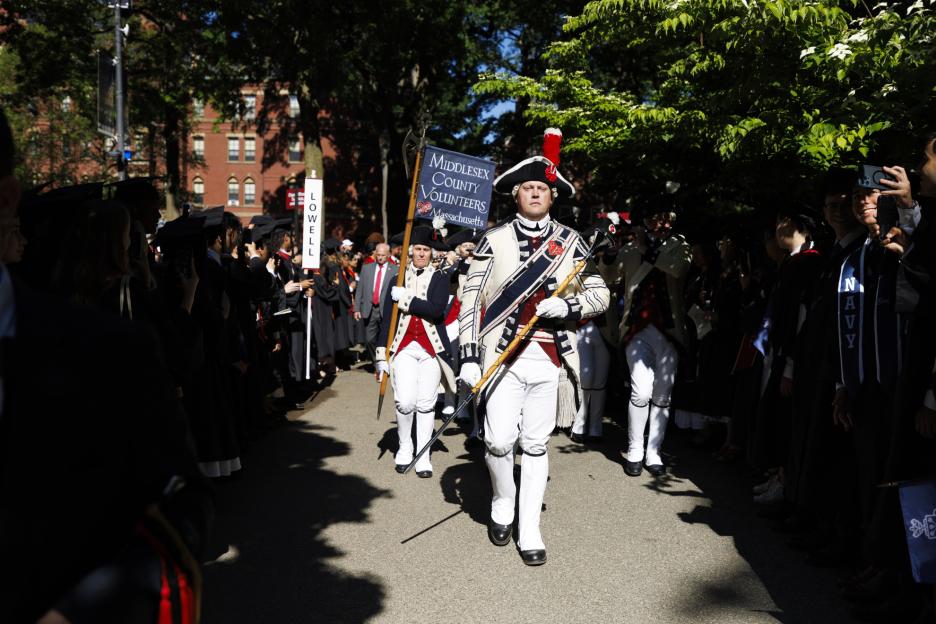 John Nichols, a Harvard employee, leads his group, the Middlesex County Volunteers Fifes and Drums, into Harvard Yard
