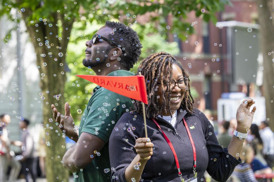 Harvard Alumni Day attendees enjoy the 360-degree photo booth at the Yard Party, 2024.