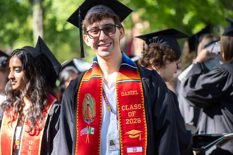 Daniel Kocot of wears a woven custom stole as a surprise gift from his parents. It reflect his father’s Mexican and his mother’s Polish heritage.