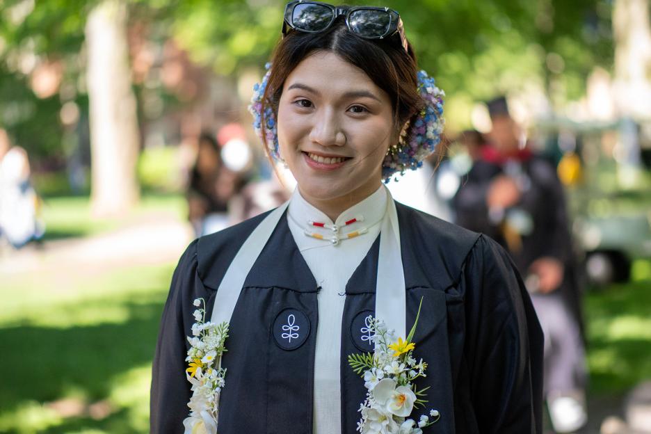 Lucy Zheng of Shanghai studied East Asian art as a Harvard undergraduate, and her Commencement outfit pays tribute to flower-wearing traditions of southern China.