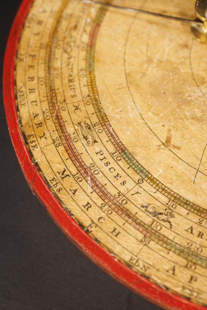 A close-up photo of a portable orrery from 1787